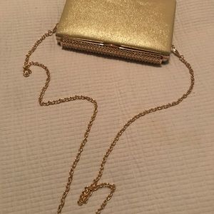 Hard-case gold and bedazzled clutch
